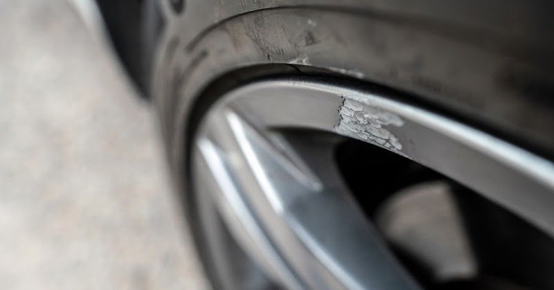 A Wheel Rim On The Front Passenger Side Scratched Due To Hitting A Curb A wheel rim on the front passenger side scratched due to hitting a curb.