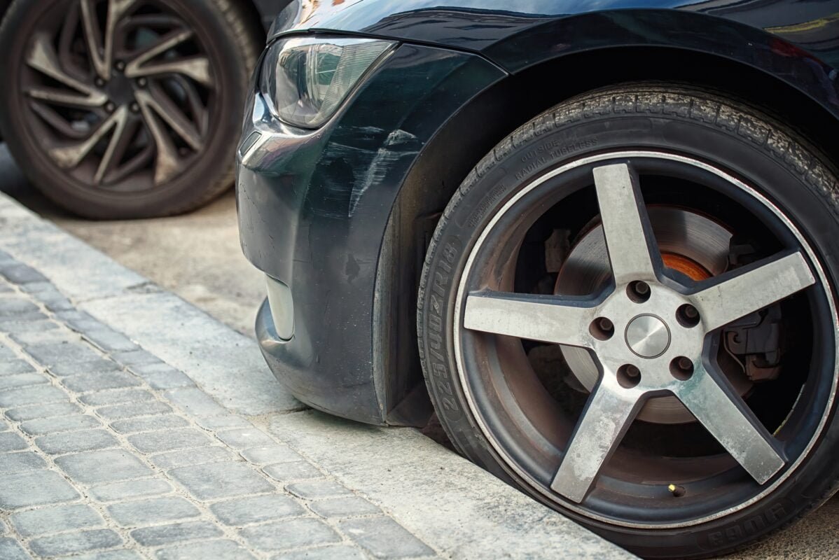 Low clearance can cause bumper damage when parked close to the curb