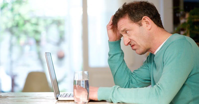 a person scratching their head