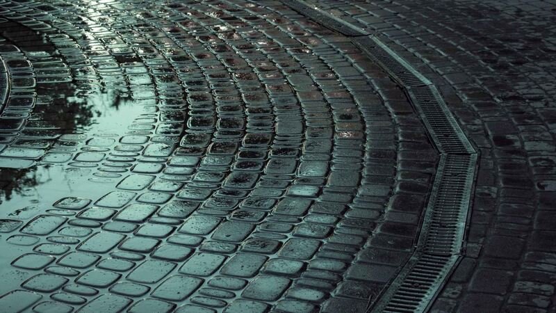 Wet Cobblestone Road