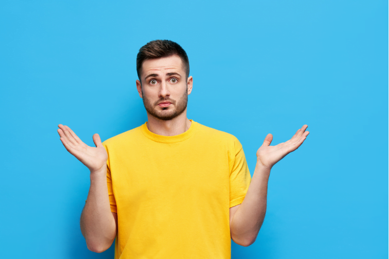 Emotions Concept Confused Man with Hands Spread Sideways
