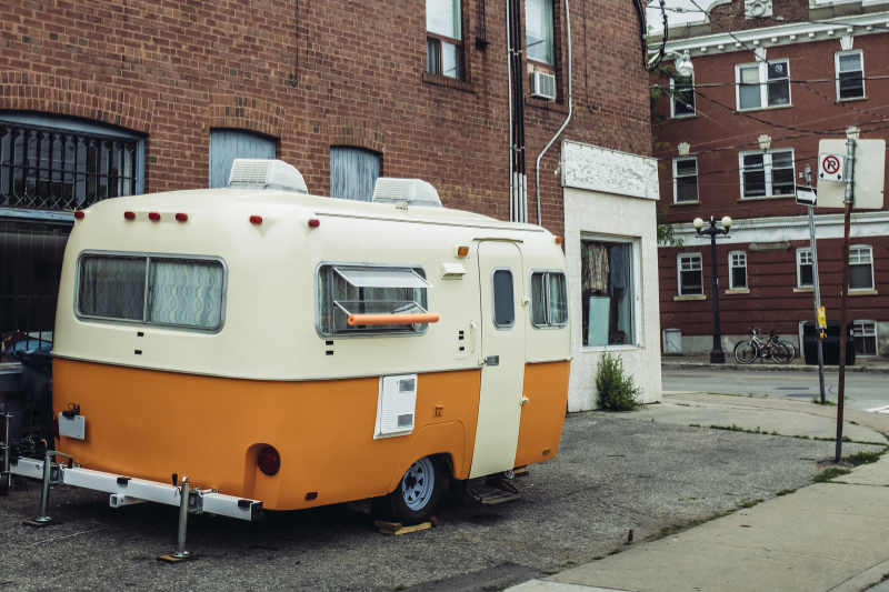 Camp Trailer Parked On The City Street Camp trailer parked on the city street