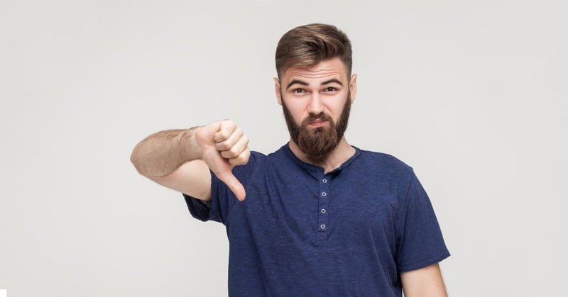 a person putting a thumbs down