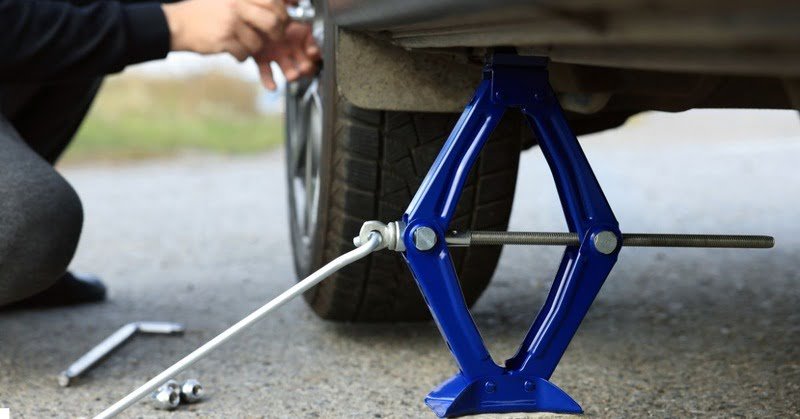 mini car scissor stand being applied on a car