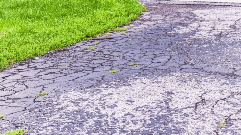 Blacktop Asphalt Driveway Damaged And Cracked